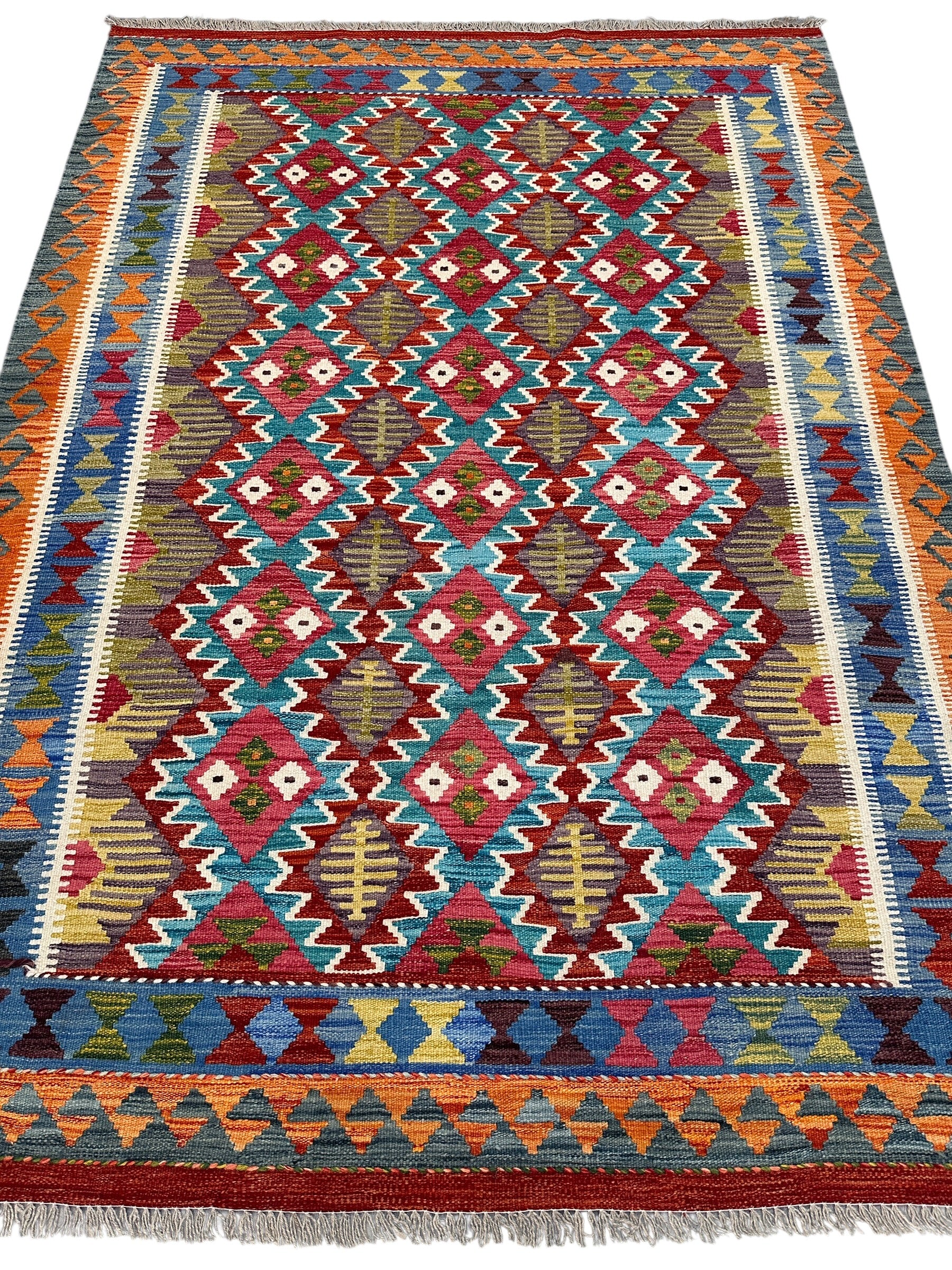 Handwoven Wool Kilim Rug 5'6" x 7'8" – Colorful Geometric Tribal Flatweave with Decorative Bound Fringe – Reversible