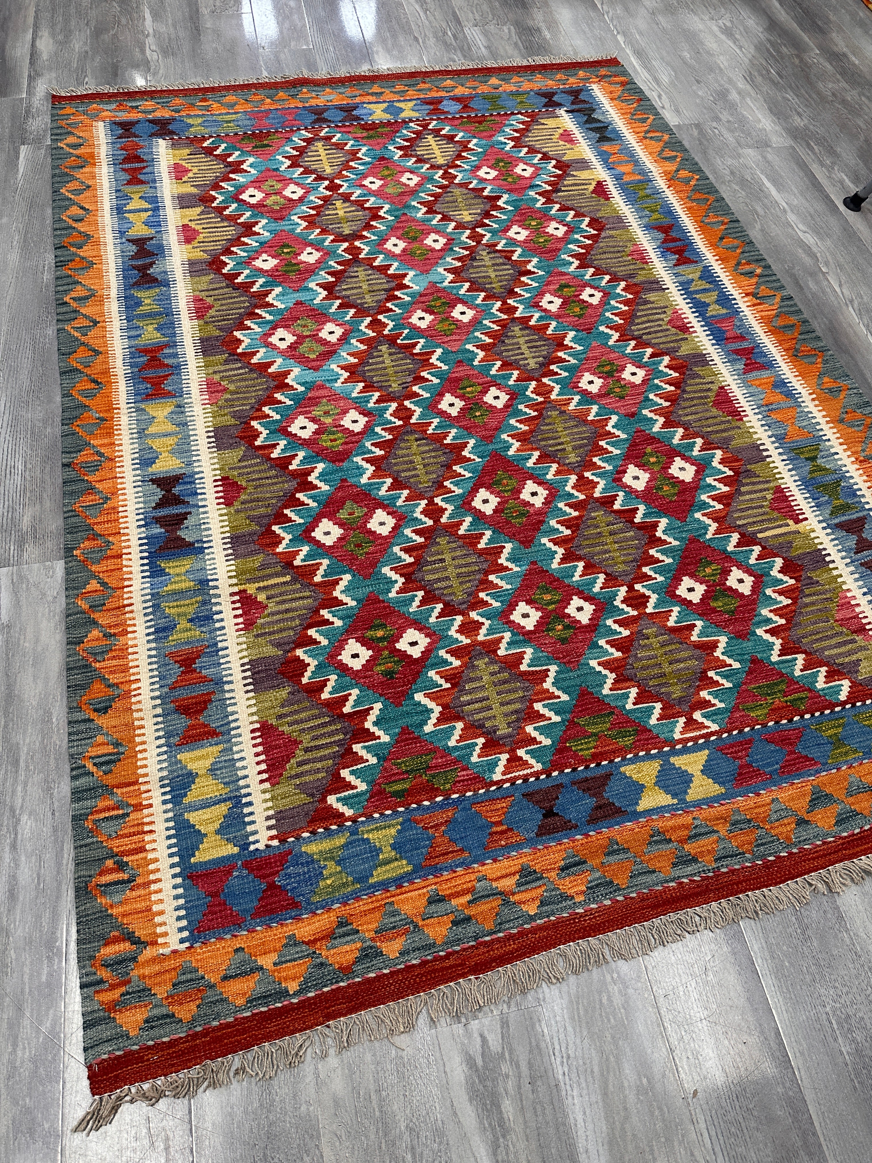Handwoven Wool Kilim Rug 5'6" x 7'8" – Colorful Geometric Tribal Flatweave with Decorative Bound Fringe – Reversible