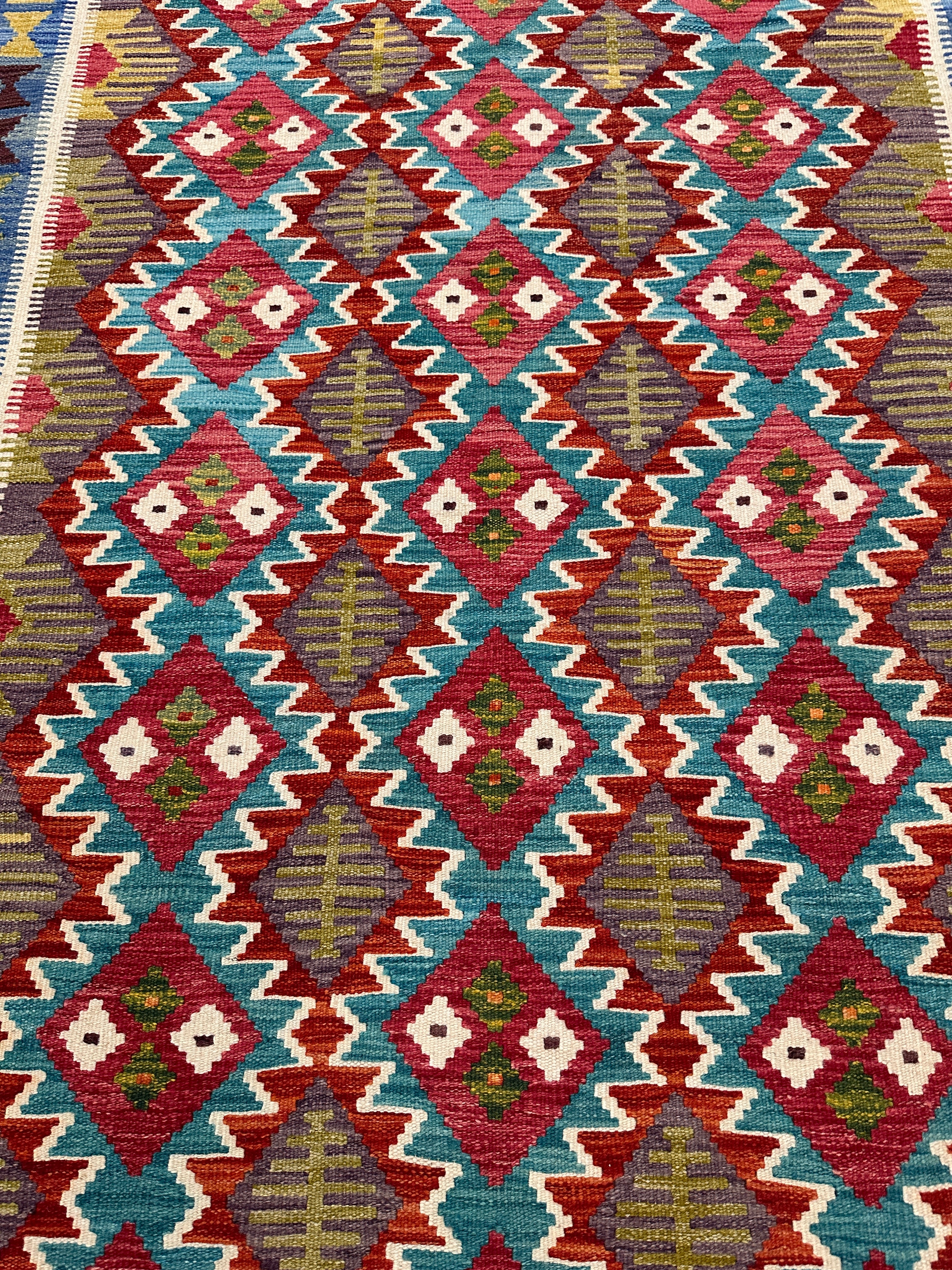 Handwoven Wool Kilim Rug 5'6" x 7'8" – Colorful Geometric Tribal Flatweave with Decorative Bound Fringe – Reversible
